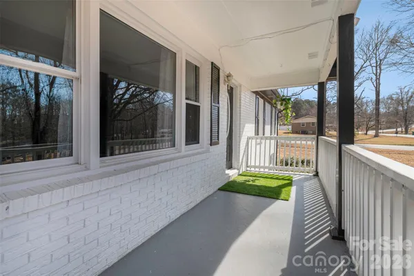 a balcony with wooden floor and outdoor space