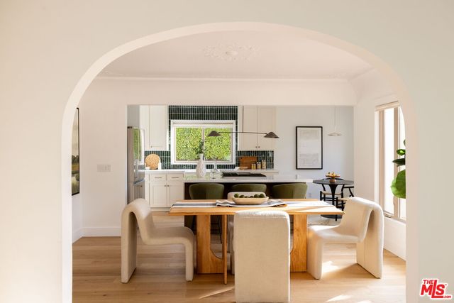 a view of a dining room with furniture and a window