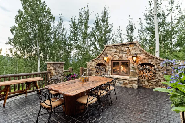 an aerial view of a house with table and chairs