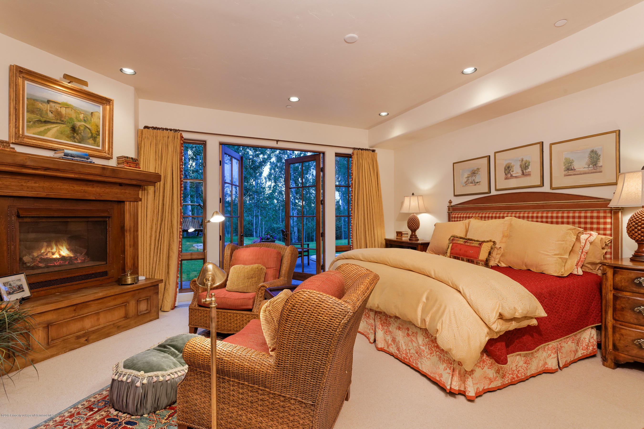 127 Powderbowl Trail Aspen, CO 81611 - Photo 15 of 31 a bedroom with a bed and a fireplace