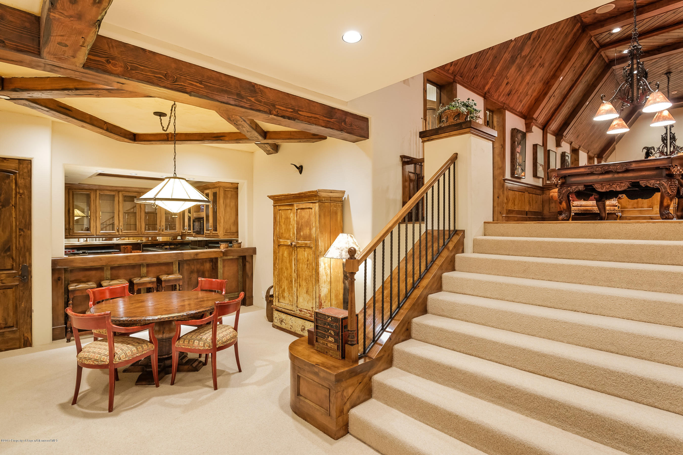 127 Powderbowl Trail Aspen, CO 81611 - Photo 17 of 31 a dining room with furniture and a chandelier