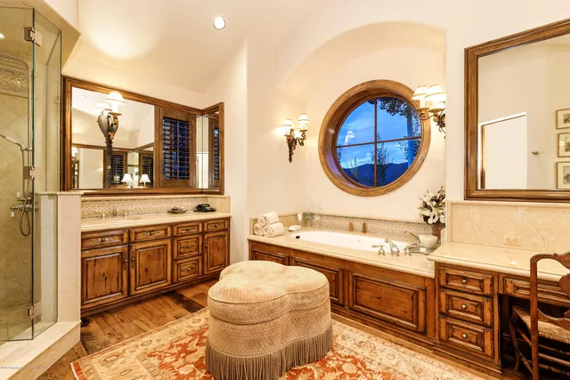 a bathroom with a sink a vanity and a mirror