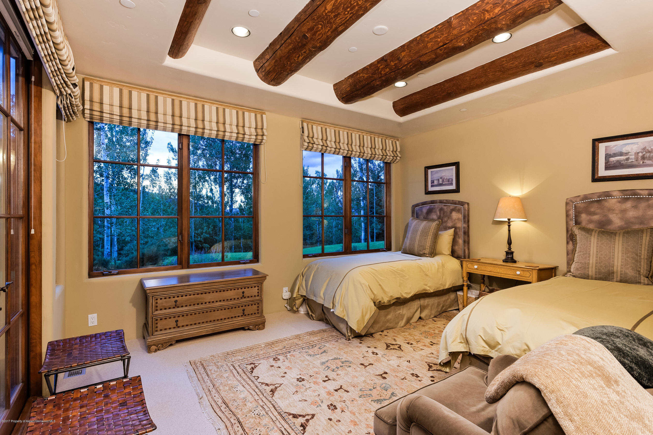 127 Powderbowl Trail Aspen, CO 81611 - Photo 20 of 31 a bedroom with two beds and a large window