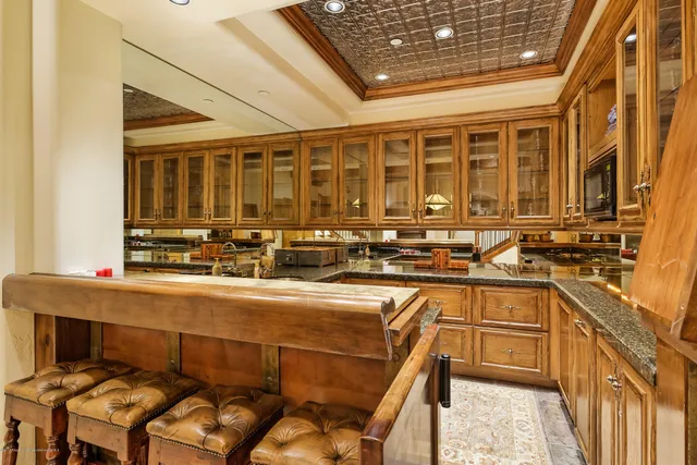 a kitchen with stainless steel appliances granite countertop a sink and cabinets