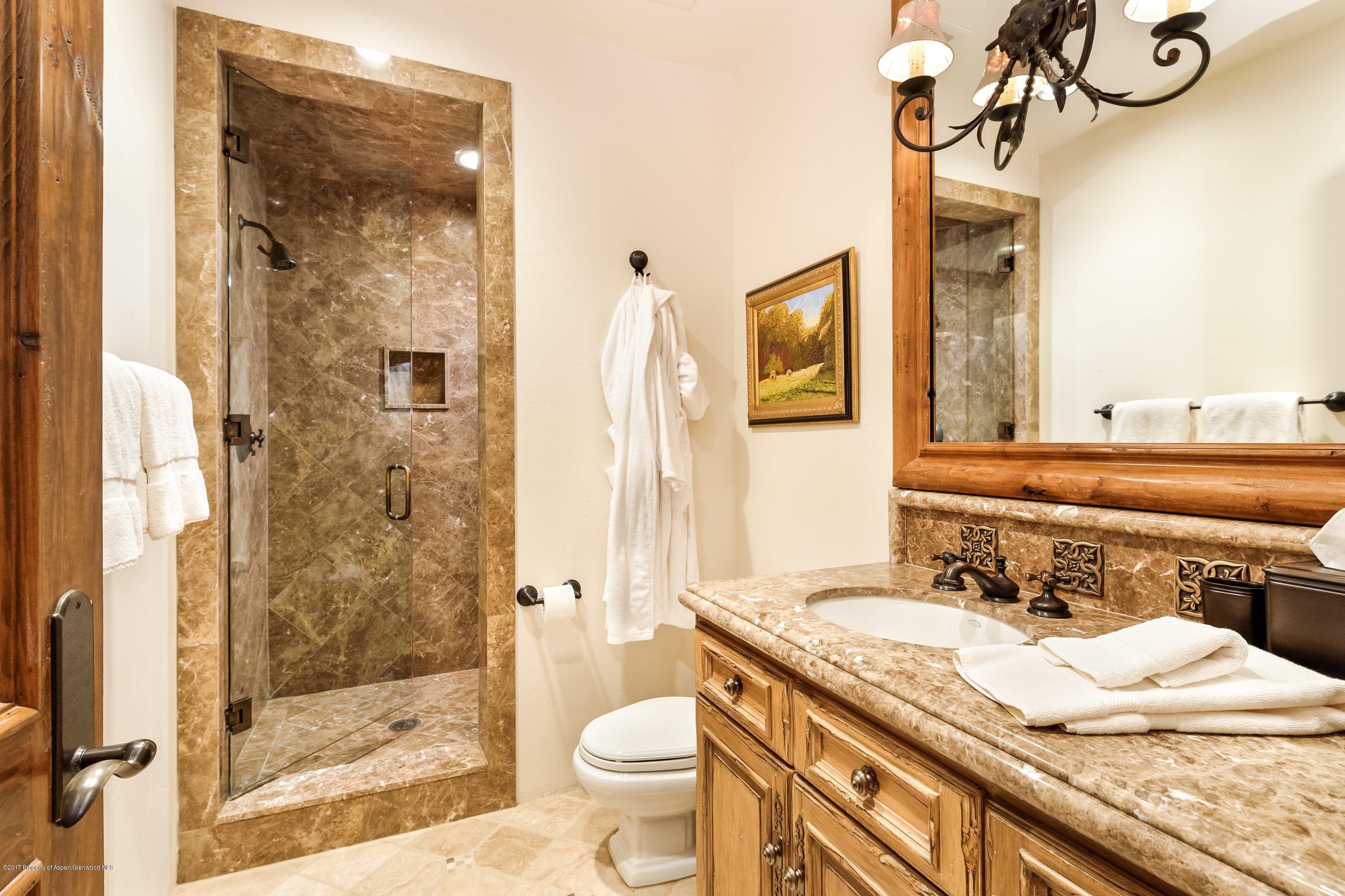 127 Powderbowl Trail Aspen, CO 81611 - Photo 27 of 31 a bathroom with a granite countertop sink toilet and shower