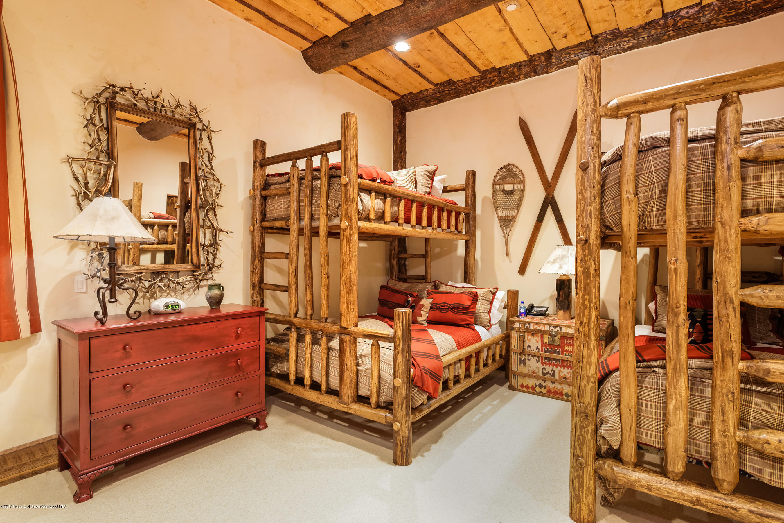 127 Powderbowl Trail Aspen, CO 81611 - Photo 30 of 31 a bed sitting in a bedroom next to a window