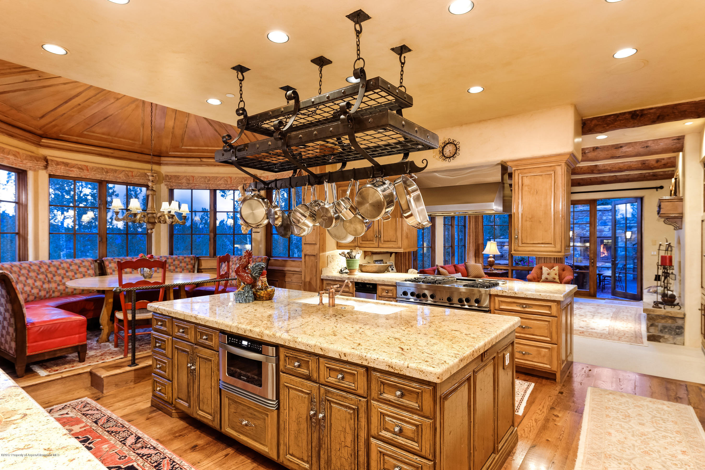 127 Powderbowl Trail Aspen, CO 81611 - Photo 4 of 31 a kitchen with stainless steel appliances granite countertop a stove and cabinets