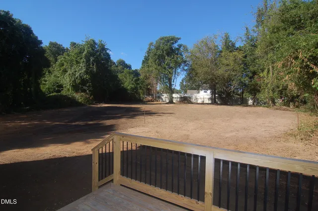 a backyard of a house with lots of green space