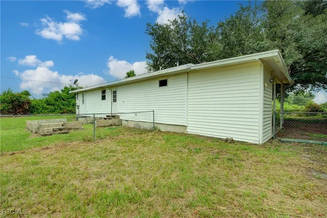 a backyard of a house with lots of green space