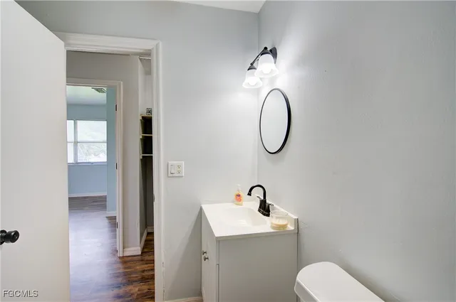 a bathroom with a toilet and a sink
