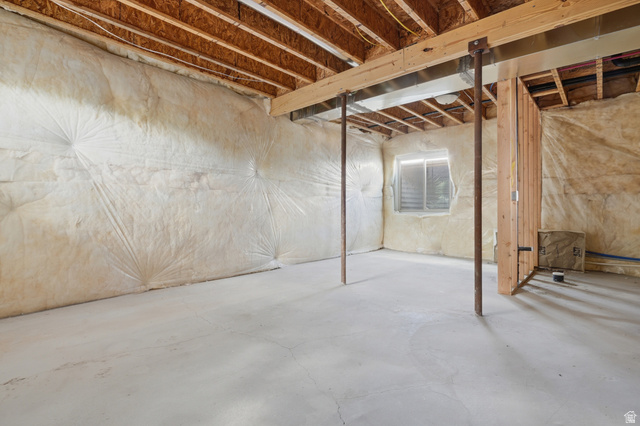 20 Q Puma Road Fairview, UT 84629 - Photo 24 of 27 Unfinished basement offering exposed wood ceiling joists, concrete flooring, and insulated walls