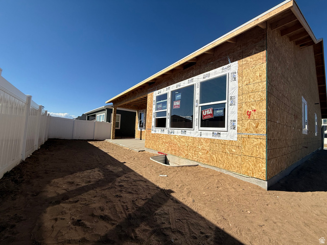 2227 Fortune Lane, Unit 448 Mapleton, UT 84664 - Photo 4 of 4 View of home's exterior with a patio area and a fenced backyard