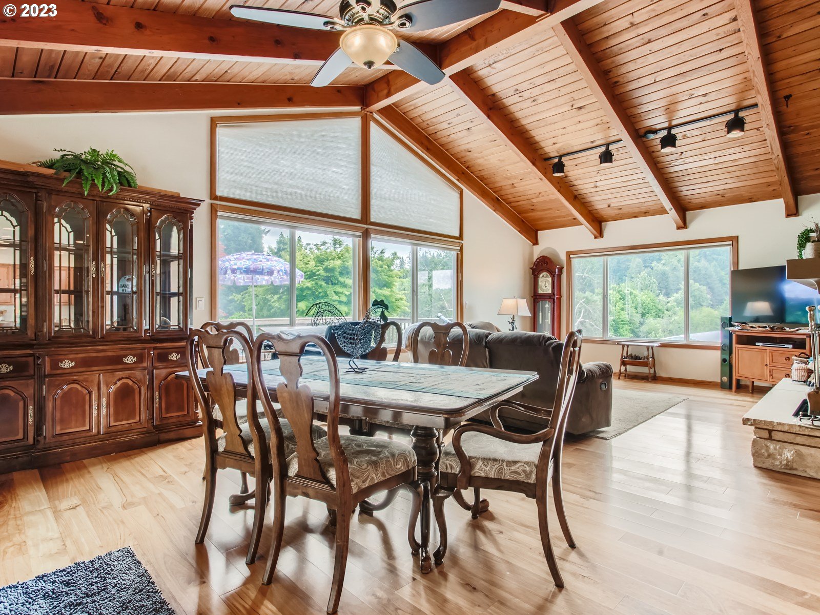 29243 Southeast Stone Road Gresham, OR 97080 - Photo 8 of 35 a dining room with furniture large windows and wooden floor