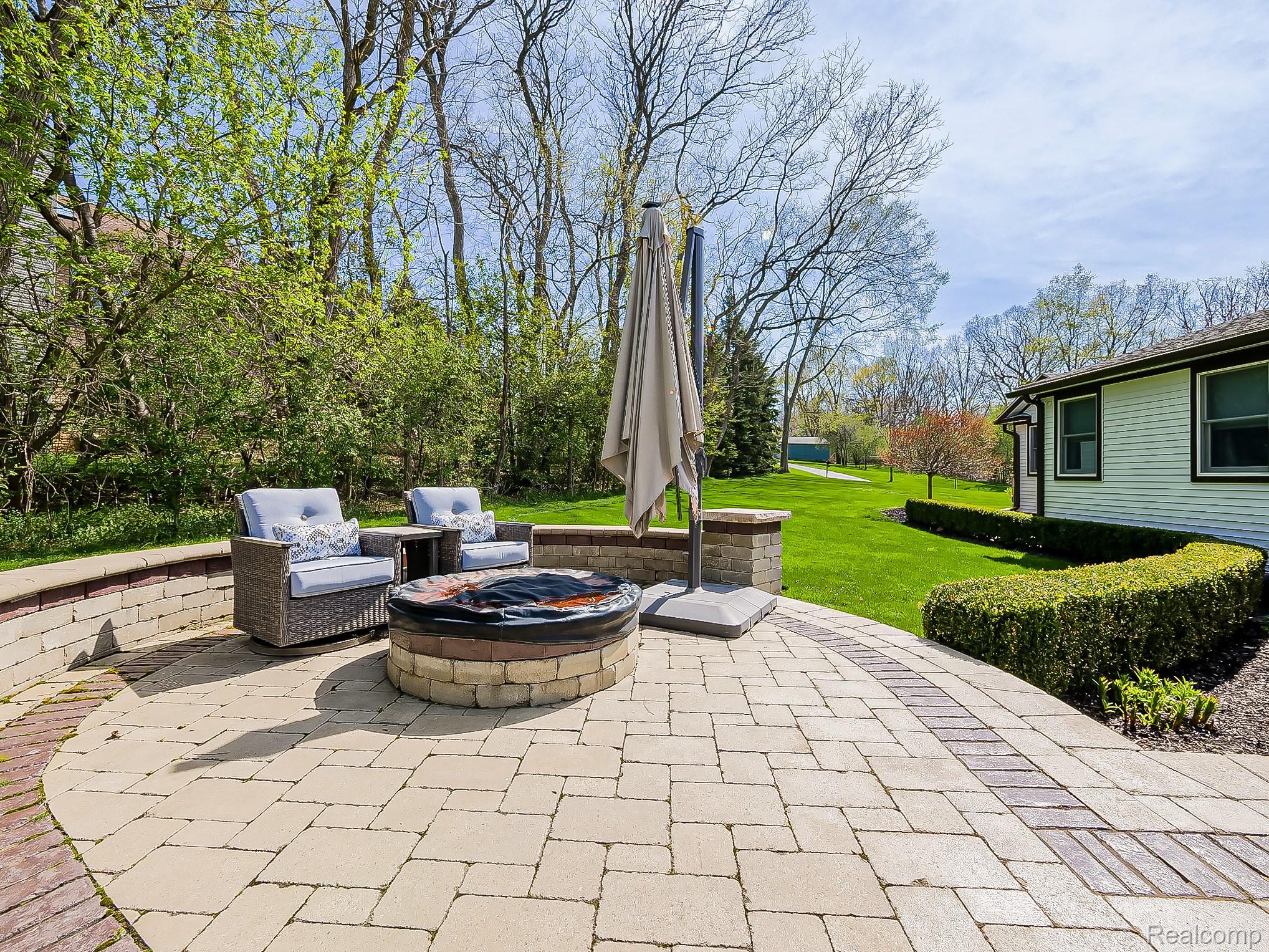 3720 East Clarkston Road Oakland, MI 48363 - Photo 49 of 60 View of patio featuring an outdoor fire pit