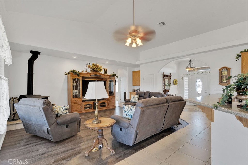 8482 Tumbleweed Road Phelan, CA 92371 - Photo 12 of 61 a living room with furniture and a chandelier