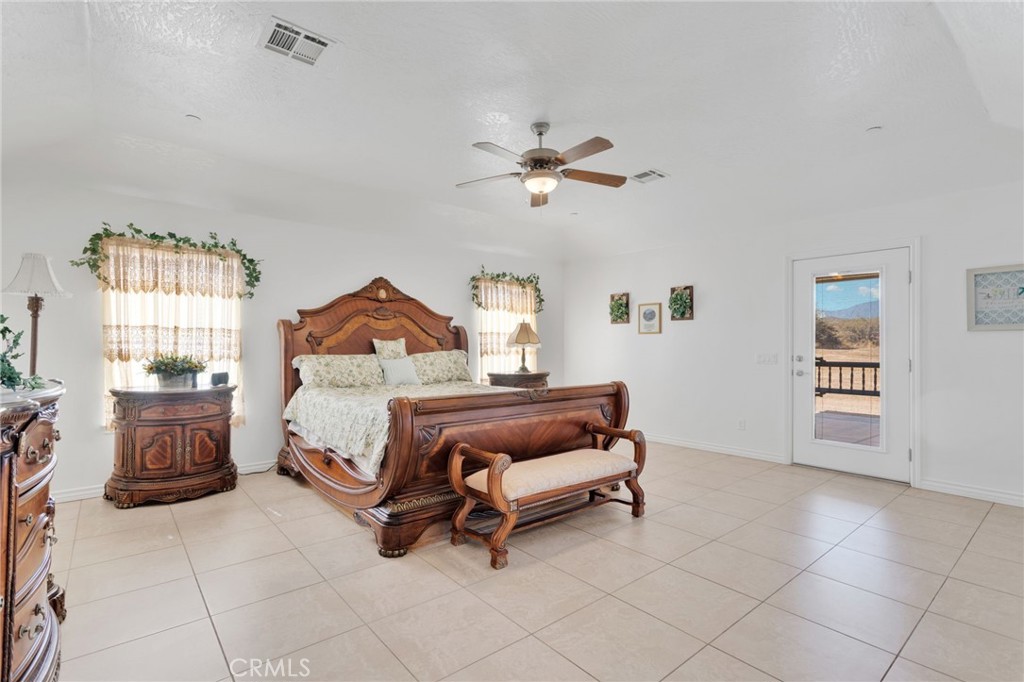8482 Tumbleweed Road Phelan, CA 92371 - Photo 20 of 61 a bedroom with furniture and window