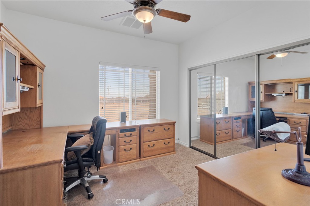 8482 Tumbleweed Road Phelan, CA 92371 - Photo 29 of 61 a view of a workspace with furniture and a window
