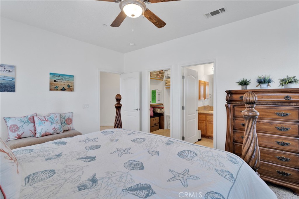 8482 Tumbleweed Road Phelan, CA 92371 - Photo 35 of 61 a bedroom with a bed and a dresser