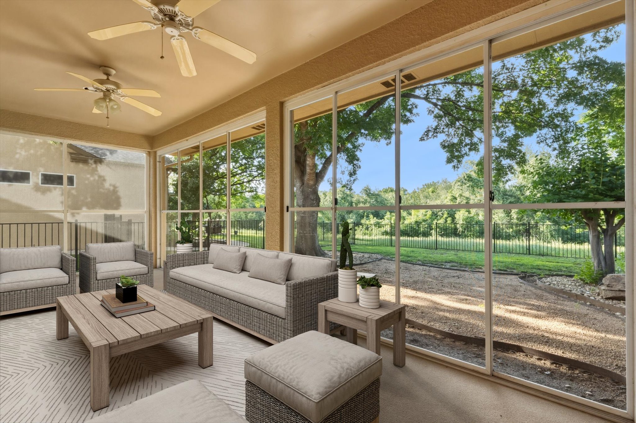 126 Trail Rider Way Georgetown, TX 78633 - Photo 21 of 30 a living room with patio furniture and a garden