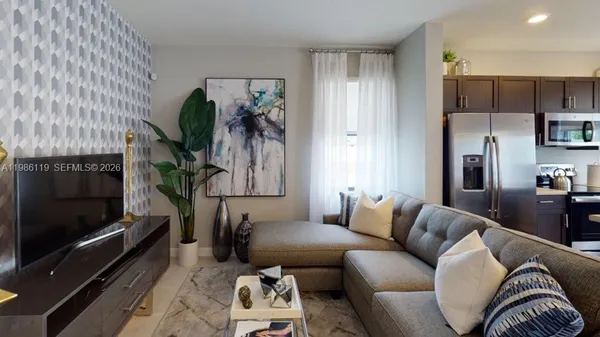 a living room with furniture and a flat screen tv