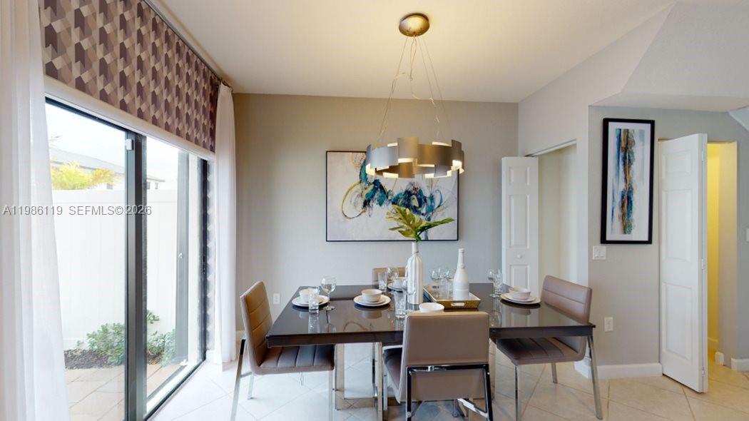 28667 Southwest 132nd Court Homestead, FL 33033 - Photo 4 of 20 a view of a workspace with furniture and a window