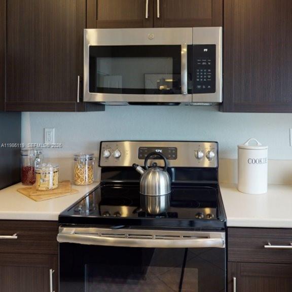 28667 Southwest 132nd Court Homestead, FL 33033 - Photo 6 of 20 a stove top oven sitting inside of a kitchen