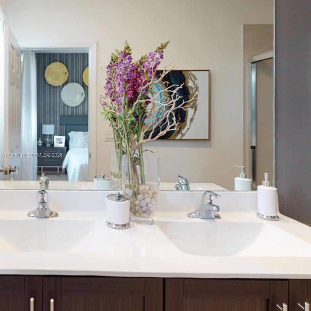 28667 Southwest 132nd Court Homestead, FL 33033 - Photo 8 of 20 a bathroom with a sink and a mirror