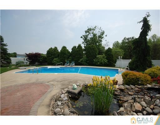 36 Higgins Road Old Bridge, NJ 08857 - Photo 2 of 12 a view of a swimming pool and a yard