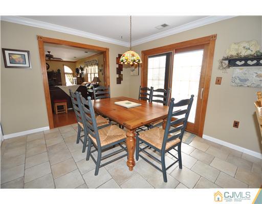 36 Higgins Road Old Bridge, NJ 08857 - Photo 11 of 12 a dining room with furniture and window