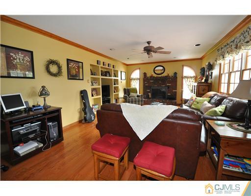 36 Higgins Road Old Bridge, NJ 08857 - Photo 6 of 12 a view of a livingroom with furniture and a flat screen tv