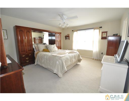 36 Higgins Road Old Bridge, NJ 08857 - Photo 7 of 12 a bedroom with a bed window and a dresser
