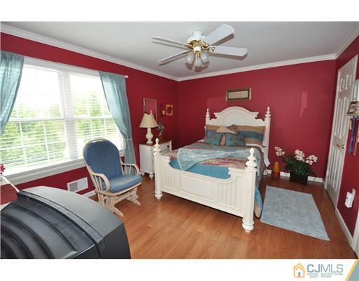 36 Higgins Road Old Bridge, NJ 08857 - Photo 10 of 12 a living room with furniture and wooden floor