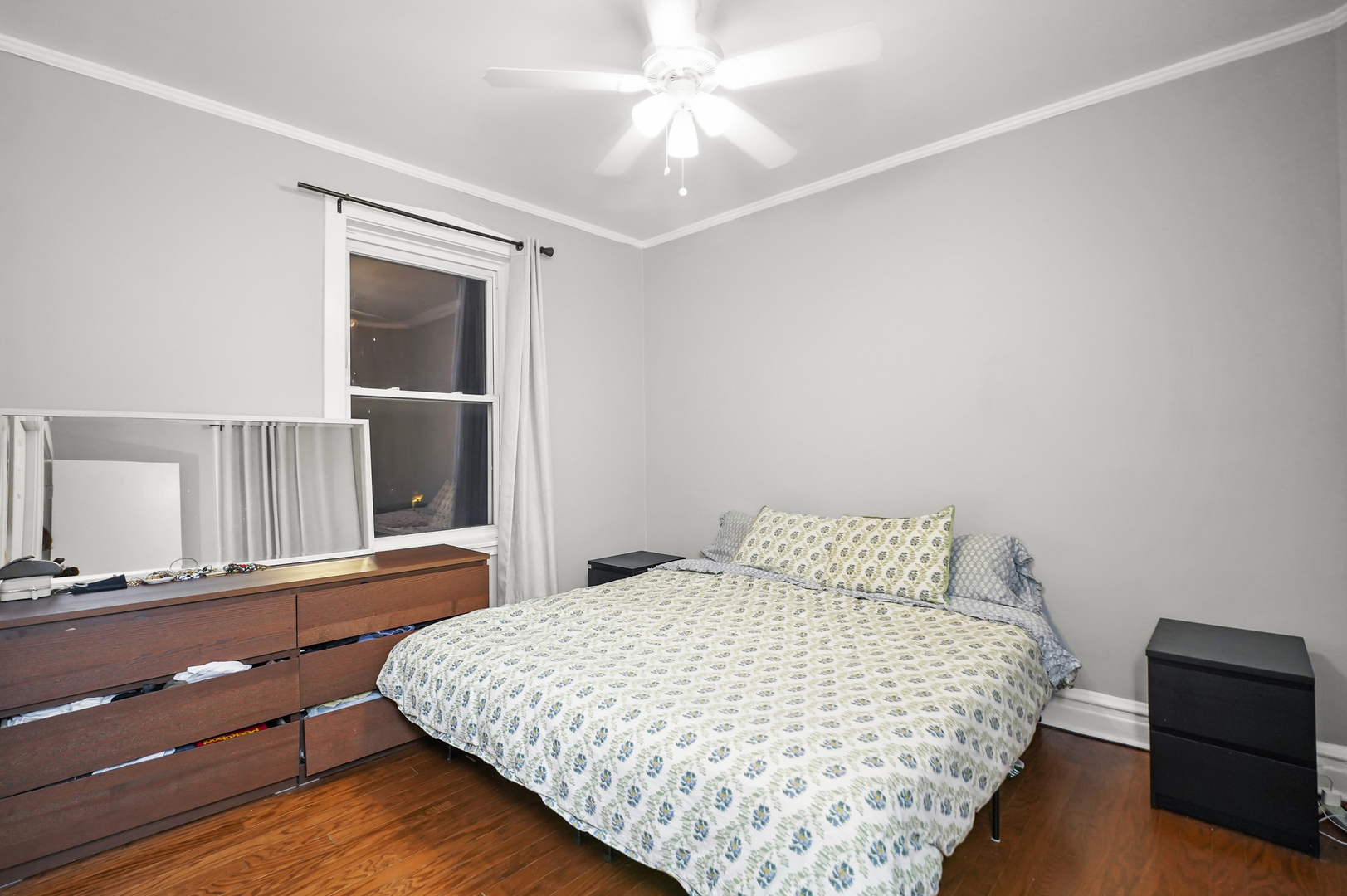 4363 North Lincoln Avenue Chicago, IL 60618 - Photo 15 of 34 a bedroom with a bed and a dresser