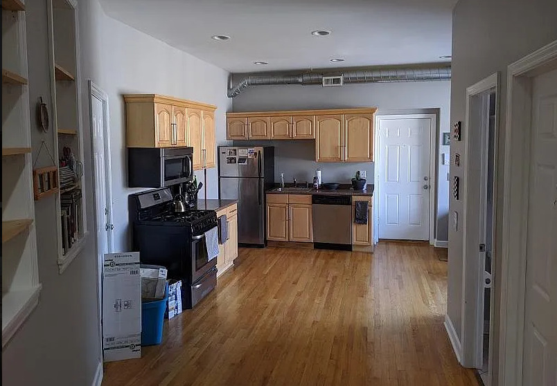 4363 North Lincoln Avenue Chicago, IL 60618 - Photo 20 of 34 a kitchen with a refrigerator a sink and wooden floor