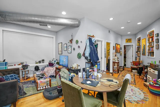 a very nice looking living room with furniture and a large window