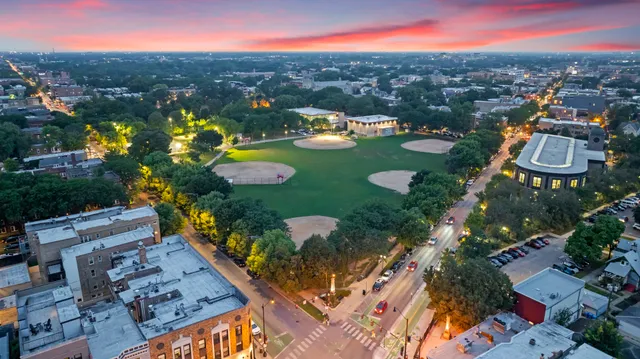 an aerial view of residential houses with outdoor space