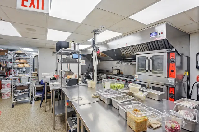 a outdoor space with lots of furniture and clutter