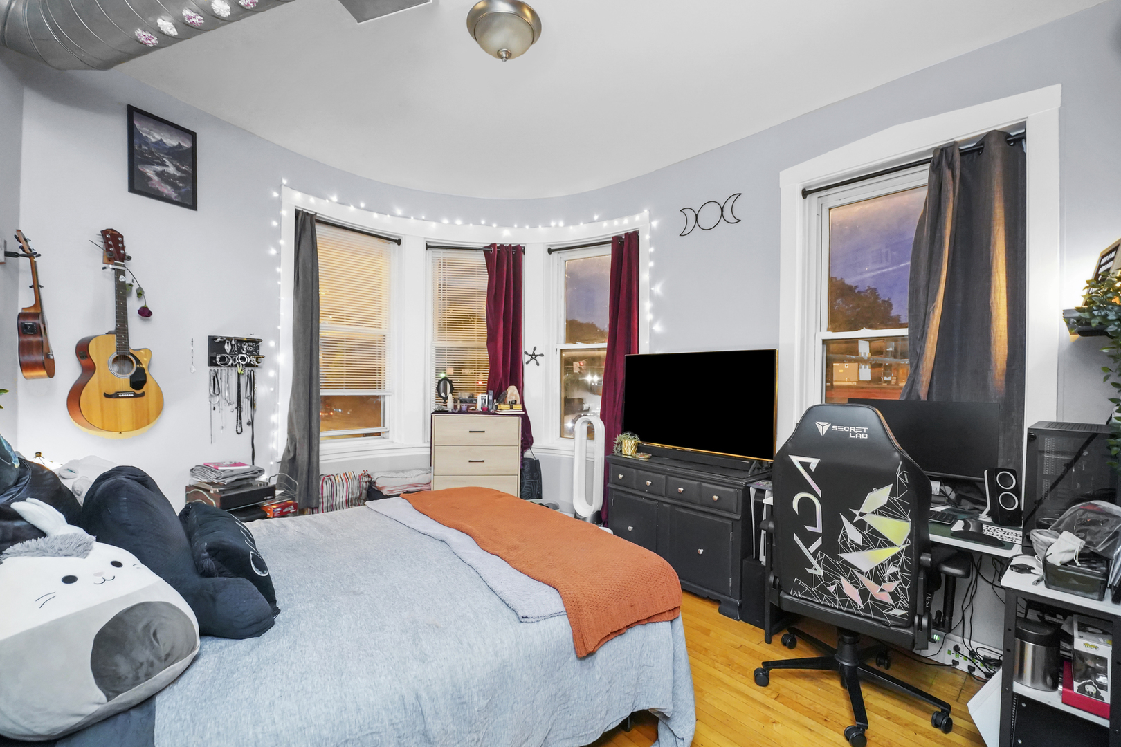 4363 North Lincoln Avenue Chicago, IL 60618 - Photo 10 of 34 a bedroom with bed and a flat tv screen on the dresser