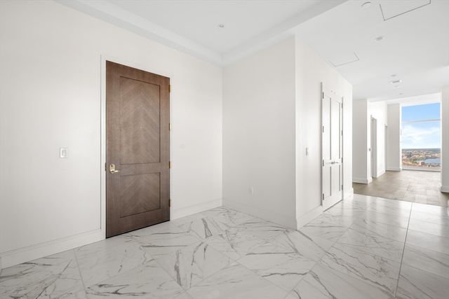 an empty room with entrance and windows