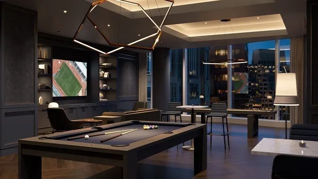 a room with furniture pool table table and chairs