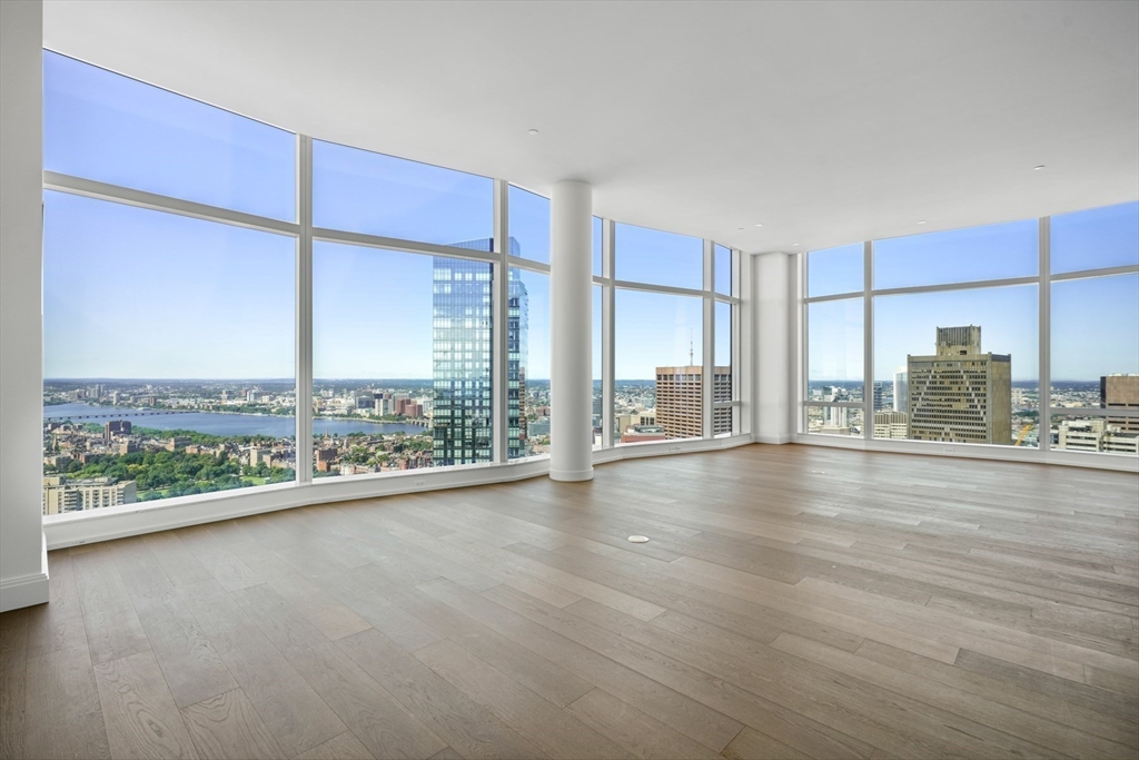 240 Devonshire Street, Unit 4901 Boston, MA 02110 - Photo 4 of 41 a view of a living room hardwood floor and an empty room