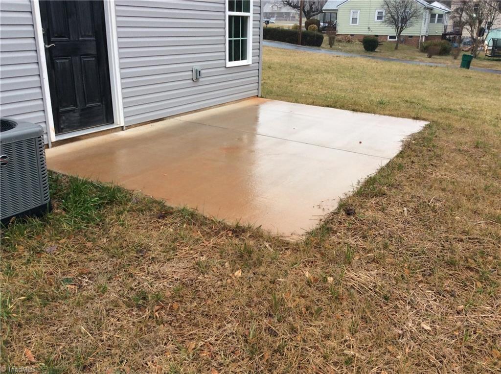 7739 Pine Street Rural Hall, NC 27045 - Photo 16 of 33 Rear Concrete Patio where you can be relaxing after a busy day.