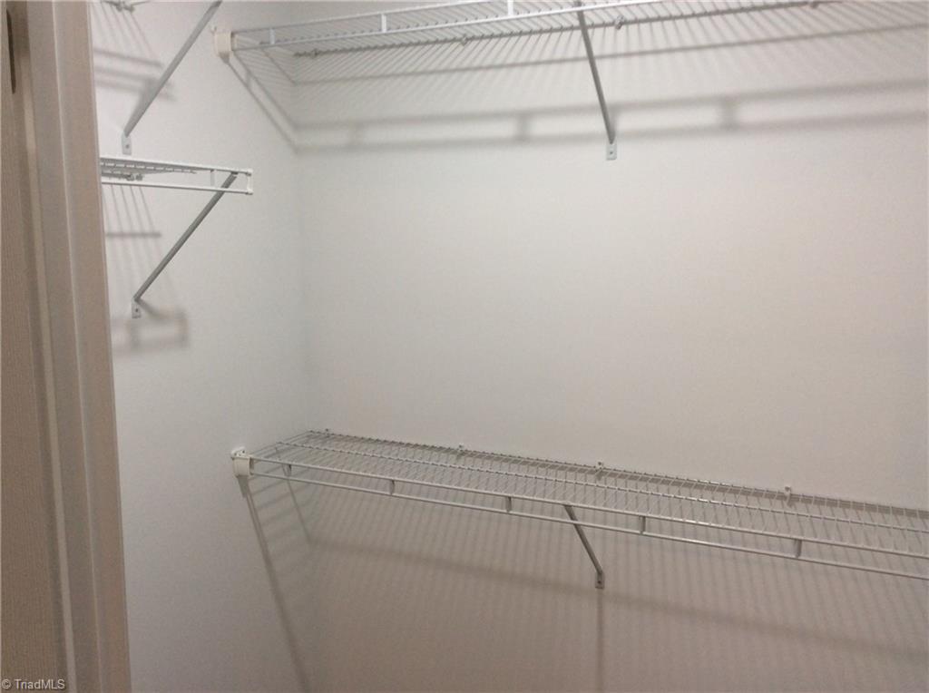 7739 Pine Street Rural Hall, NC 27045 - Photo 6 of 33 WIC with wire rack shelving.