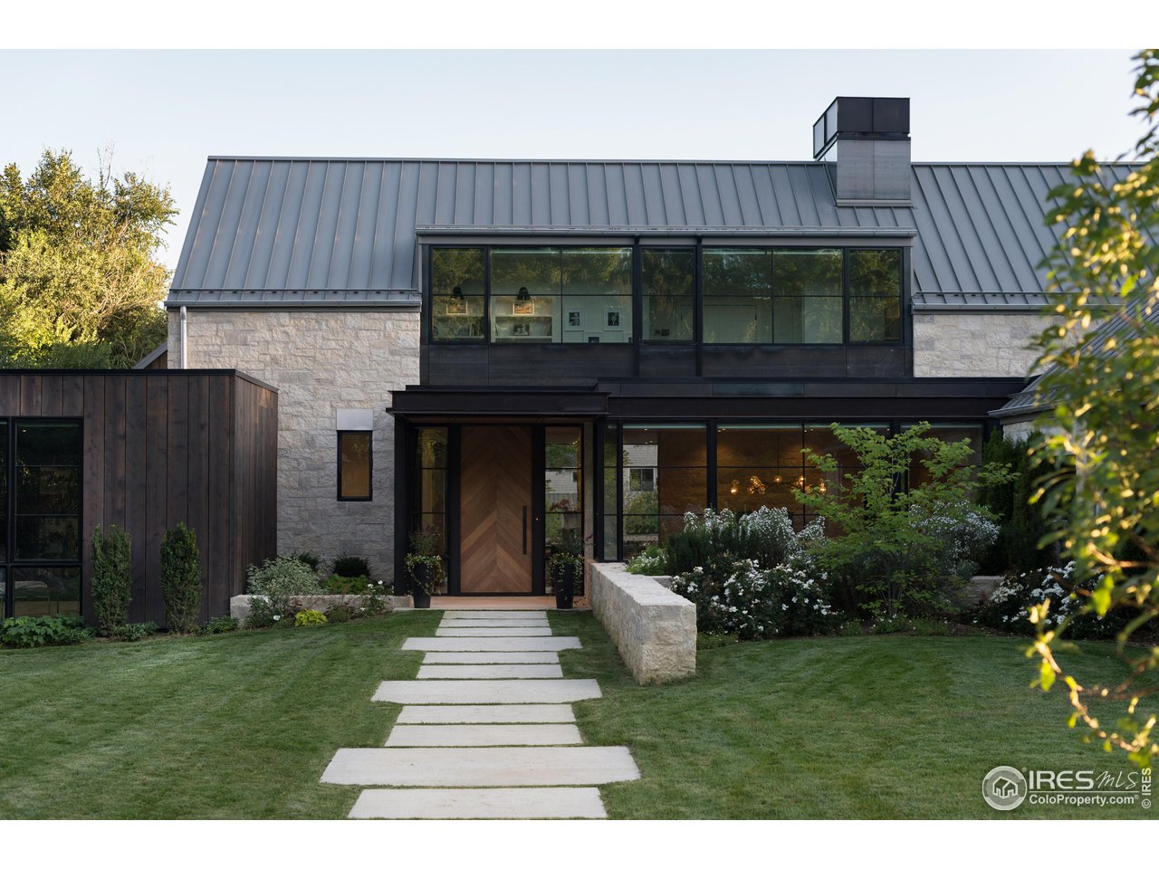 2260 Meadow Avenue Boulder, CO 80304 - Photo 21 of 21 a front view of a house with a garden