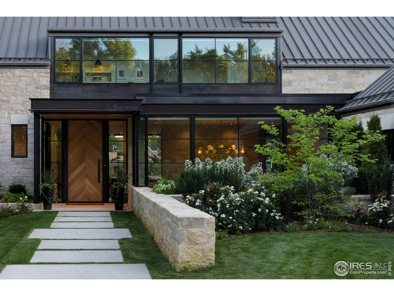 2260 Meadow Avenue Boulder, CO 80304 - Photo 3 of 21 a front view of a house with a yard