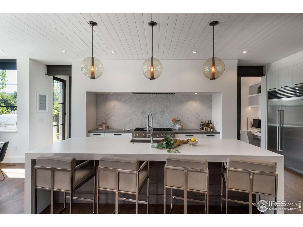 2260 Meadow Avenue Boulder, CO 80304 - Photo 8 of 21 a kitchen with a table chairs stove and cabinets