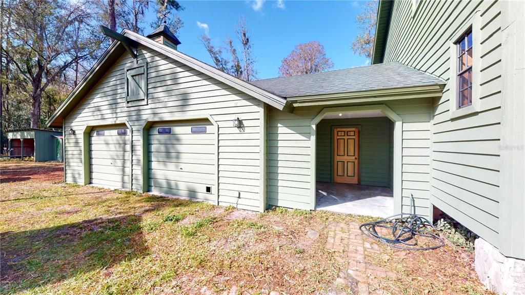 19803 Reading Road Lutz, FL 33558 - Photo 11 of 48 a view of a house with a backyard and floor to ceiling window