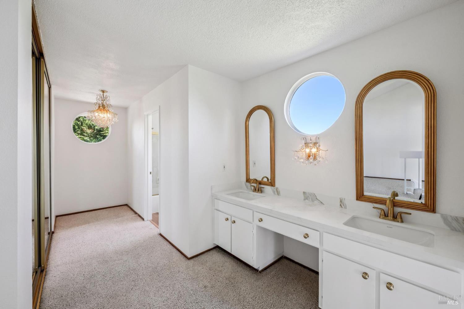 4987 Fern Place Rohnert Park, CA 94928 - Photo 36 of 54 a bathroom with a double vanity sink and a mirror