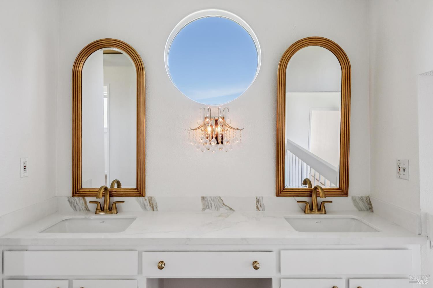 4987 Fern Place Rohnert Park, CA 94928 - Photo 37 of 54 a bathroom with a double vanity sink and a mirror