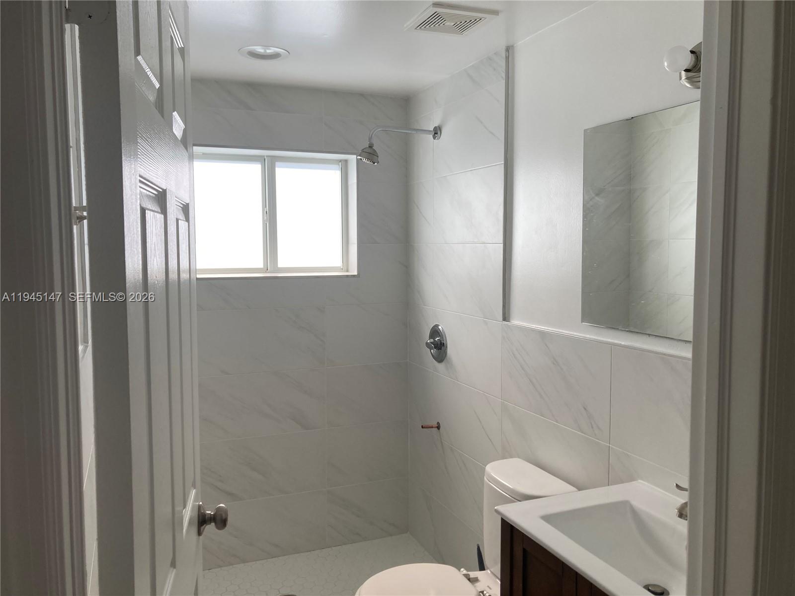 447 Southwest 78th Court Miami, FL 33144 - Photo 8 of 11 a bathroom with a sink a toilet and shower